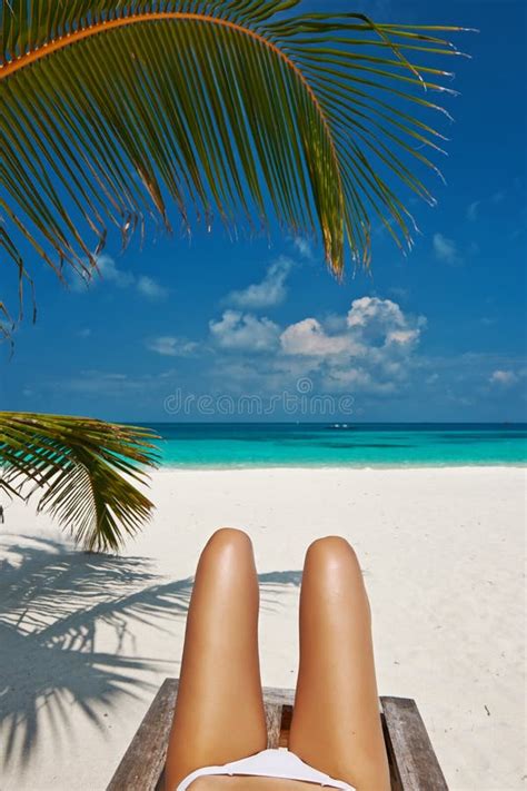 Woman At Beach Lying On Chaise Lounge Stock Photo Image Of Legs