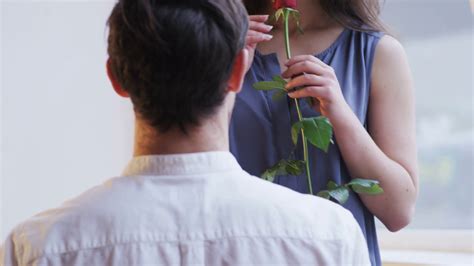 A Man Gives Red Rose To Woman Hugs Him Stock Footage Sbv 310802083