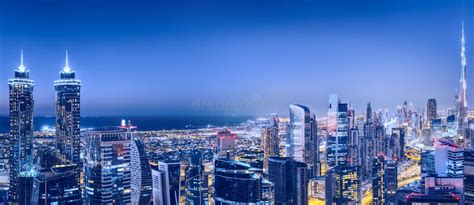 Aerial Panoramic Skyline Of A Big Futuristic City By Night Business