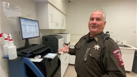 Booking arrestees at the Sangamon County Jail - YouTube