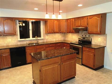 These includes rich shades of brown, which. oak cabinets with dark brown countertop - Google Search ...