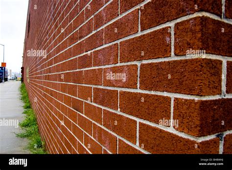 The corner and wall of a long brick wall as seen in perspective Stock Photo: 27921086 - Alamy