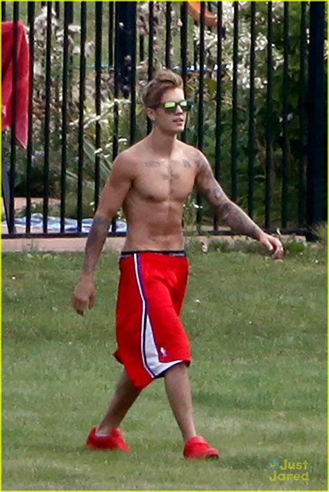 Shirtless Justin Bieber Lounges At The Pool With Bikini Clad Girl Photo Photo Gallery
