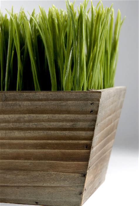 A faux plant and planter. Wood Planter Box 24" Grass Centerpiece