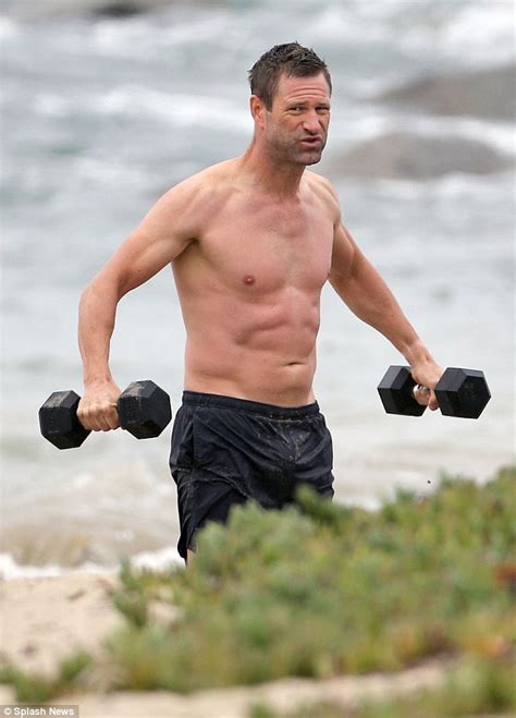 shirtless aaron eckhart 45 shows off impressive physique during beachside shoot after new