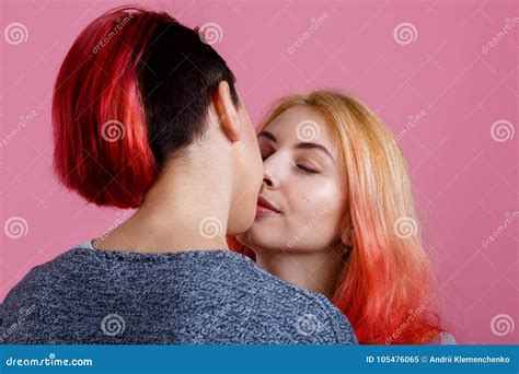 Lesbians Kiss On A Pink Background Side View At An Angle Stock Image Image Of Detail