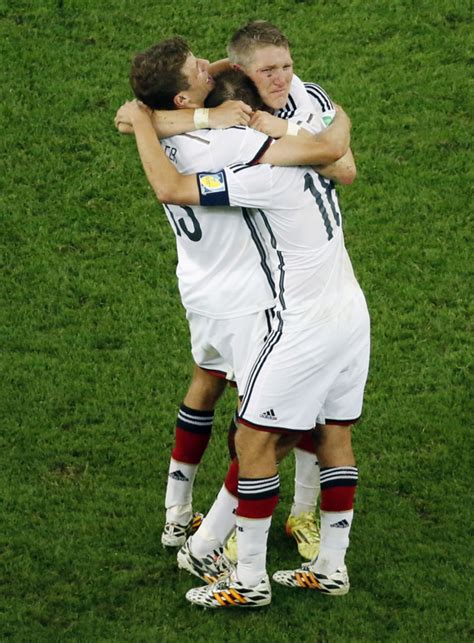 from left germany s thomas mueller philipp lahm and bastian schweinsteiger celebrate after the