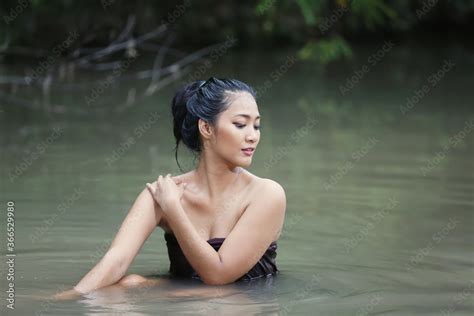 beautiful asian women are bathing in the river asia girl in thailand asian girl take a shower