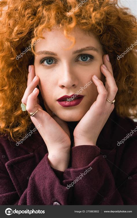 Close Attractive Curly Redhead Woman Looking Camera Touching Face Stock