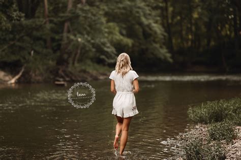 senior girl poses creek nature outdoors standing senior pictures high school s