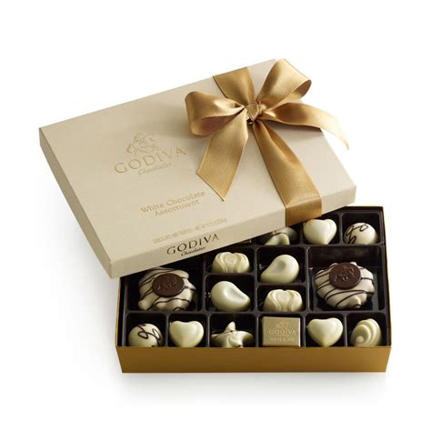 Beehive chocolate store is all about delivering happiness! White Chocolate Gift Box - Gold Ribbon - 24 pc. | GODIVA