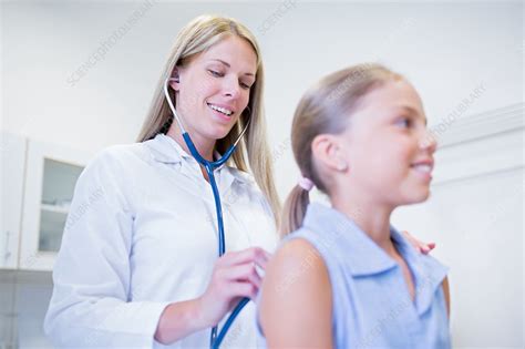 Doctor Examining Girl Stock Image F0209334 Science Photo Library