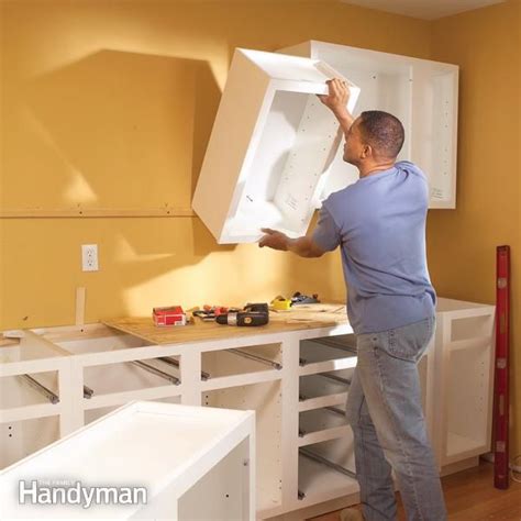 Wireless or battery under cabinet lights eliminate both of in kitchens with limited outlets or many competing appliances, wireless under cabinet lighting is an ideal solution. How to Install Kitchen Cabinets | Installing kitchen ...