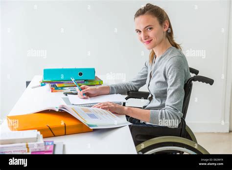 Woman In Wheelchair Working Stock Photo Alamy