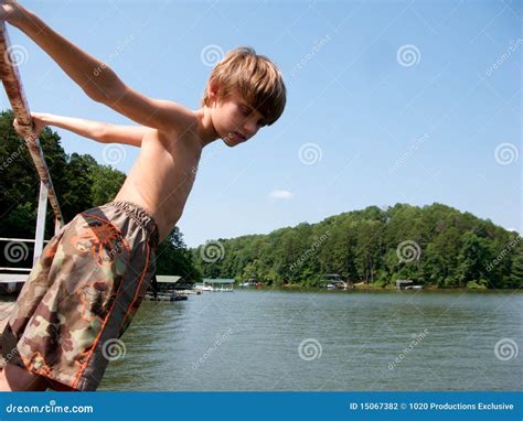 Boy Ready To Dive In Lake Stock Photo Image Of Leans 15067382