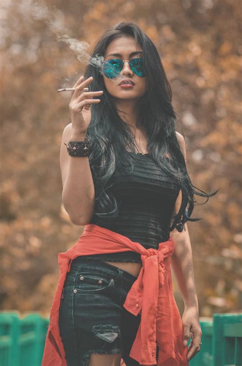 Download Cool Attitude Girl Smoking And Wearing Sunglasses Wallpaper