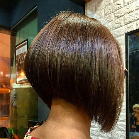 Bring one section forward at a time, and determine how much you want to take off—we suggest a quarter of an inch to half an inch. How to cut a Bob hair at home? | Recool Hair