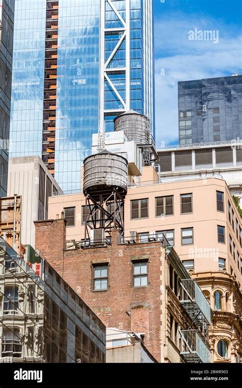 Water Tower On Rooftop In New York City City Rooftop Hi Res Stock