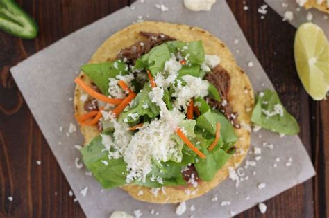 Slow Cooker Barbacoa Beef Tostada With A Jalapeno Lime Sauce Slow