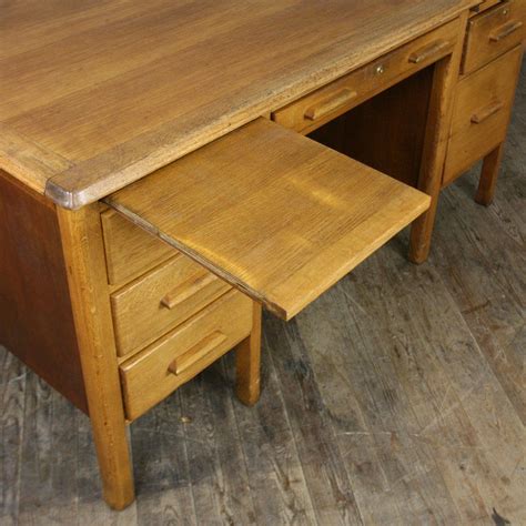 A Large Vintage Oak Desk Produced In The 1940s 50s Primarily For Use