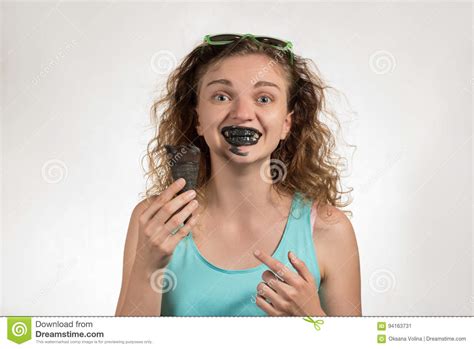 Beautiful Cheerful Girl With Curly Hair Eats Black Ice Cream In Stock Image Image Of Brunette