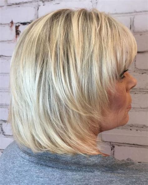 Silver white wispy hairstyle medium length shag haircuts with dramatic colors, like this gray and white wispy hairstyle medium shaggy hairstyles. 20 Youthful Shaggy Hairstyles for Fine Hair over 50
