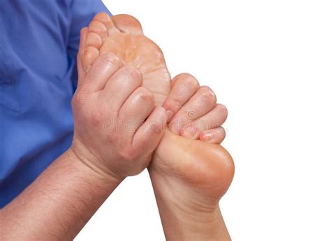 The Doctor Podiatrist Does An Examination And Massage Of The Patient`s