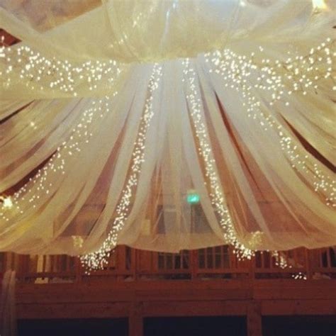 Using fabric to decorate a room is an inexpensive way to add color, pattern and charm. How to Decorate a Ceiling with Tulle and Lights ...