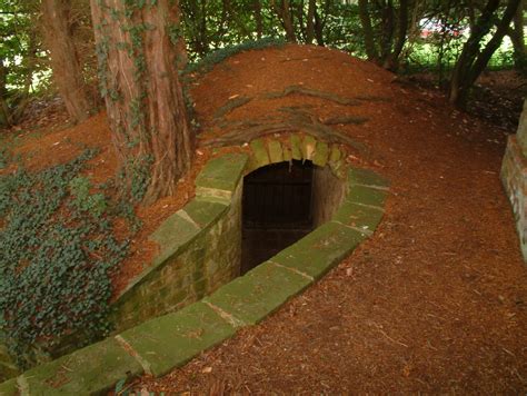 neat construction for a hillside hidden outdoor room hidden passage into house or root cellar