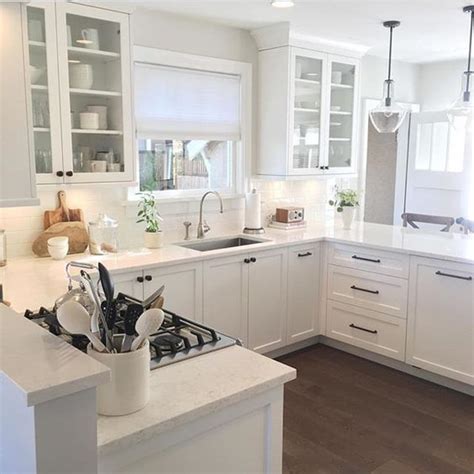 Waterfall white quartz kitchen countertop with dark wooden cabinets. How to Choose the Right White Quartz for Kitchen ...