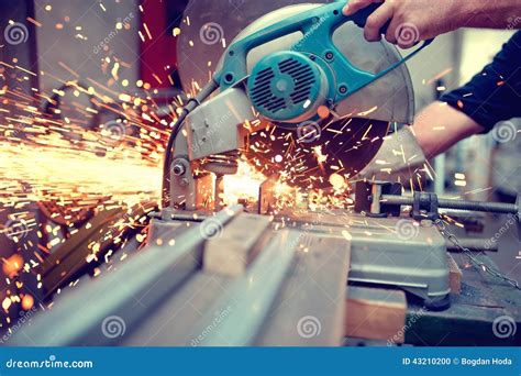 Industrial Engineer Working On Cutting A Metal And Steel Stock Photo