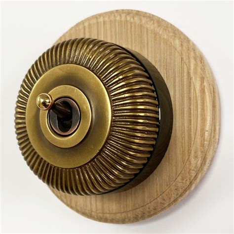 Reeded Round Dolly Light Switch 1 Gang Antique Satin Brass Black Base