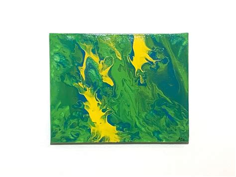 A Green And Yellow Painting On A White Wall