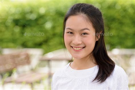 Face Of Happy Young Beautiful Asian Woman Smiling At The Coffee Shop