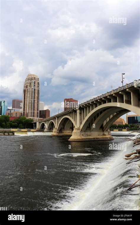 Minneapolis Downtown Skyline And Third Avenue Bridge Above Saint