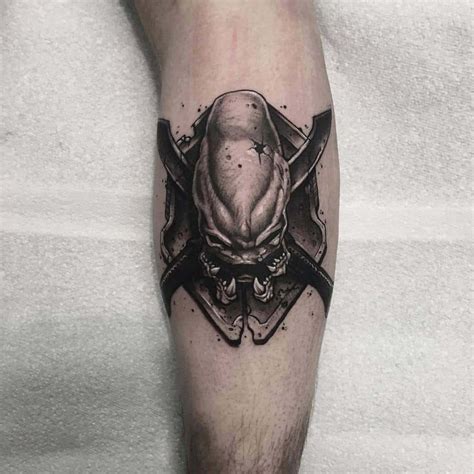 A Mans Leg With A Skull And Two Crossed Axes On It In Black Ink