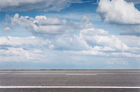 Empty Asphalt Road Over Blue Sky Side View Stock Photo Download Image