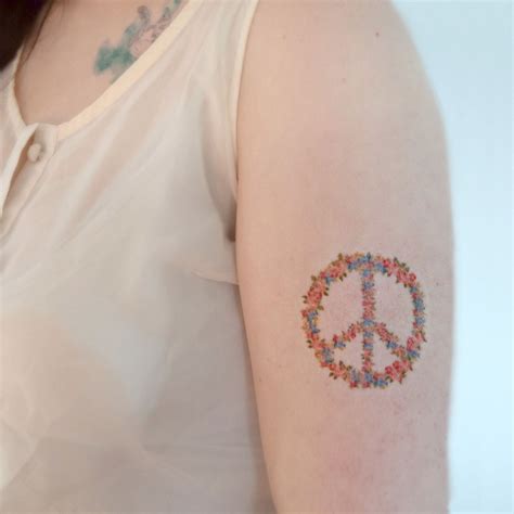 What does the peace sign mean on a tattoo? Popular items for floral peace sign on Etsy | Hippie ...