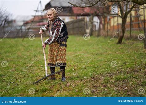 Old Farmer Woman Cleaning With A Rake Stock Image Image Of Person