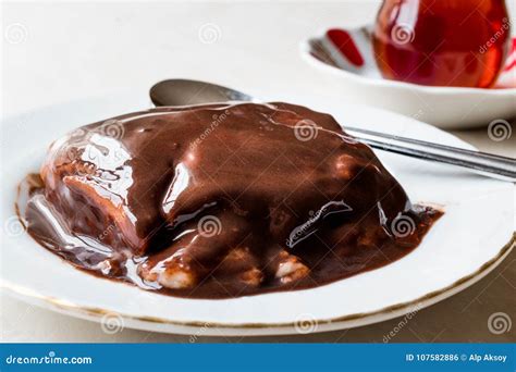 Turkish Pudding Muhallebi With Chocolate Sauce And Traditional Tea