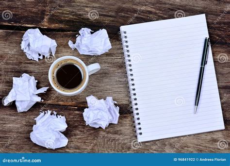 Notepad With Pen Coffee And Crumpled Paper On Desk Stock Photo Image