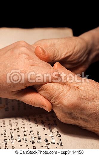 Old And Young Hands On The Bible Canstock