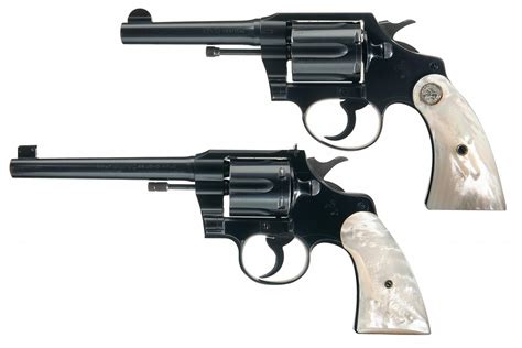 Collectors Lot Of Two Colt Double Action Revolvers With Pearl Grips