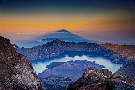 Shadow Of Mount Rinjani Volcano At Sunrise Indonesia Writes