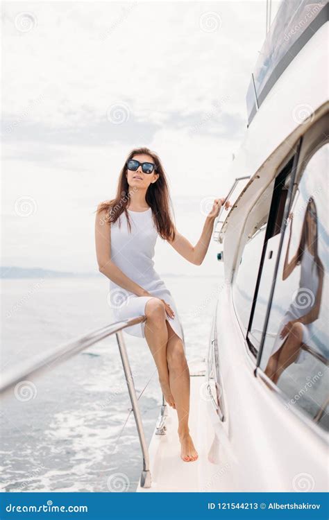 Caucasian Female Model In Glasses Posing On Luxury Sailing Boat Stock