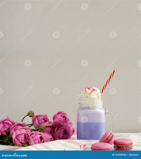 Purple Coffee In Stylized Mason Jar Cup With Macarons And Roses And
