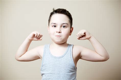 Kid Flexing Biceps Stock Photo Download Image Now Istock