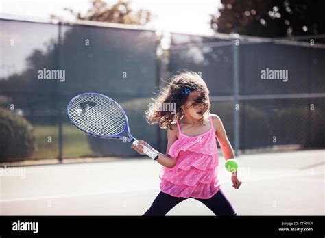 Girl Playing Tennis On Court Stock Photo Alamy