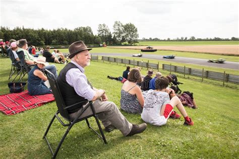 People Watching A Motorsport Race At A Race Track Editorial Stock Image