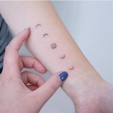 Watercolor Moon Phases Tattoo On The Inner Forearm